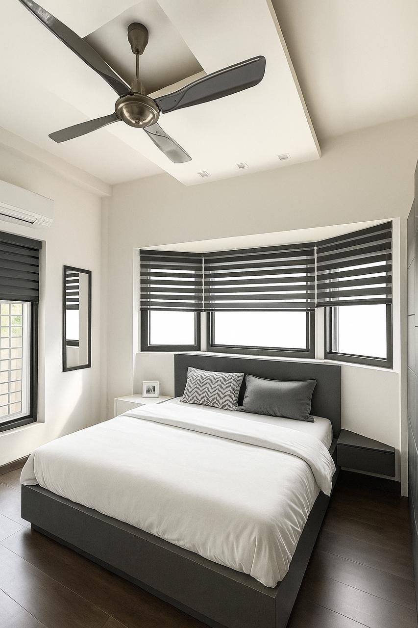 Bright bedroom with white bedding and black framed windows